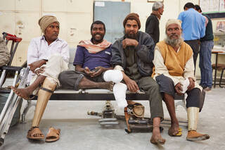 The Jaipur Foot prosthetic being used by Disabled men in India who have lost limbs