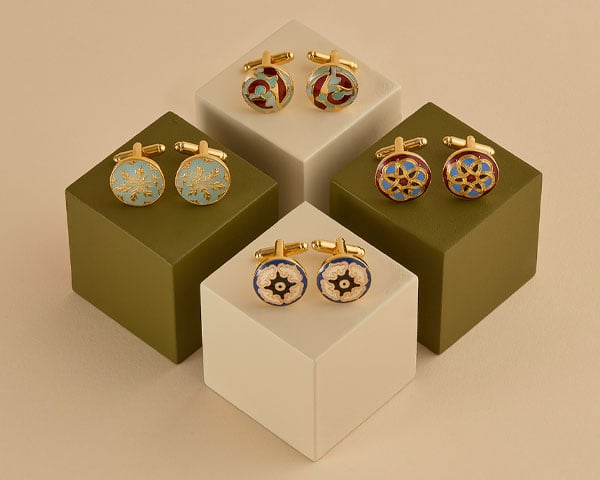 Cufflinks - Jewellery for him Three pairs of cufflinks propped up on plinths.